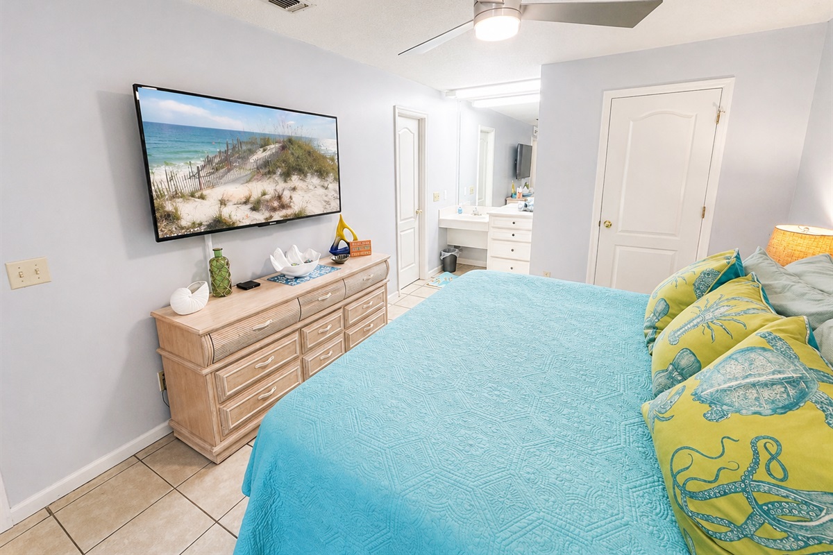Master bedroom with a king bed and flatscreen TV