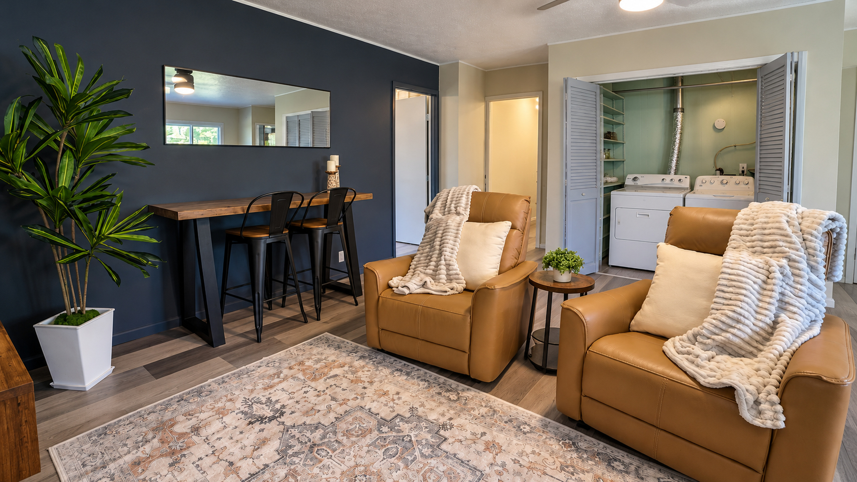 Laundry tucked behind bifold doors in the family room—stay connected while loads get done!
