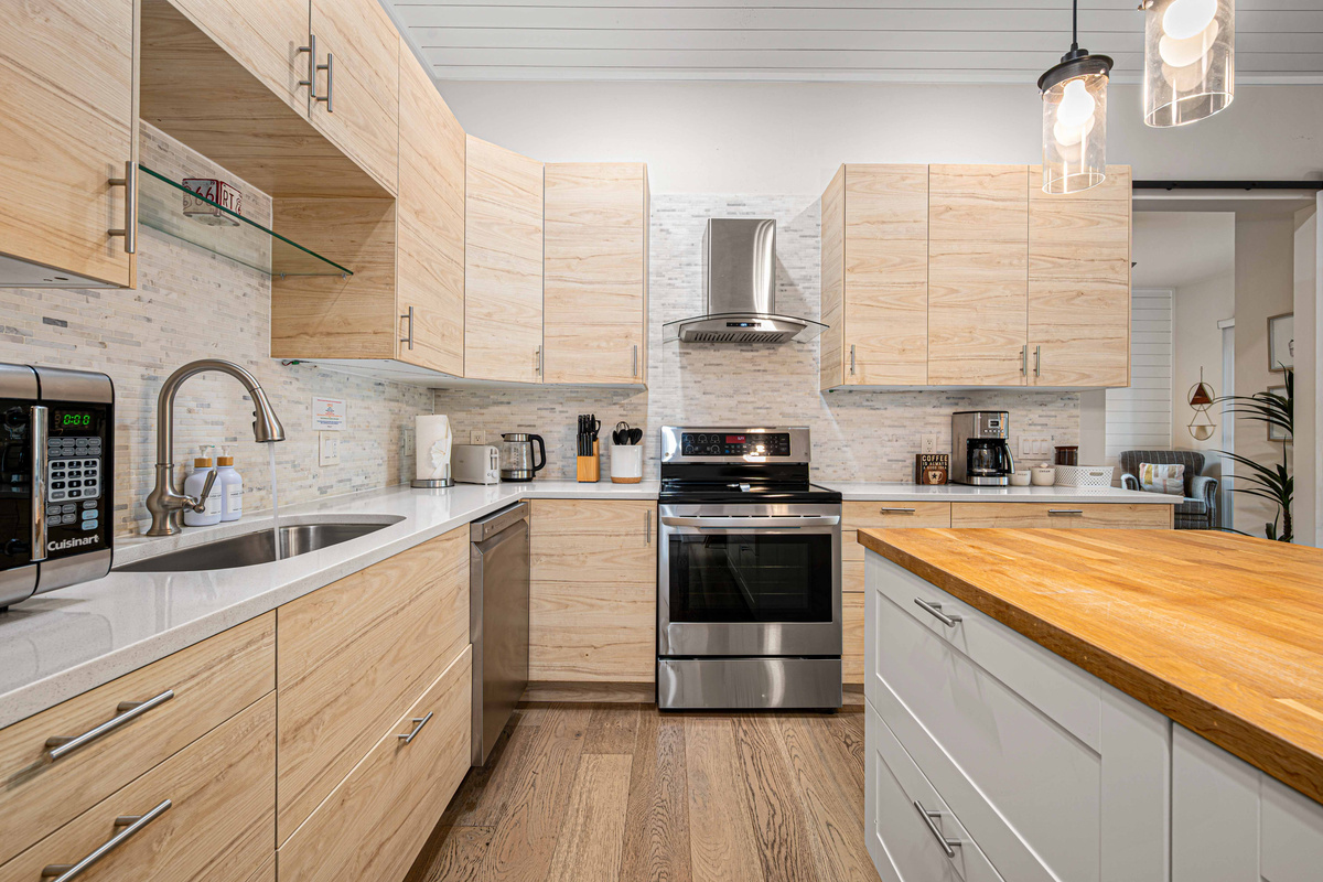 {Gourmet Kitchen} Cook at home in a spacious, fully equipped kitchen with generous prep space and modern appliances.