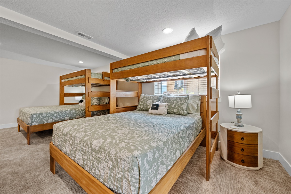 This lower level bedroom has two twins over two queen beds.