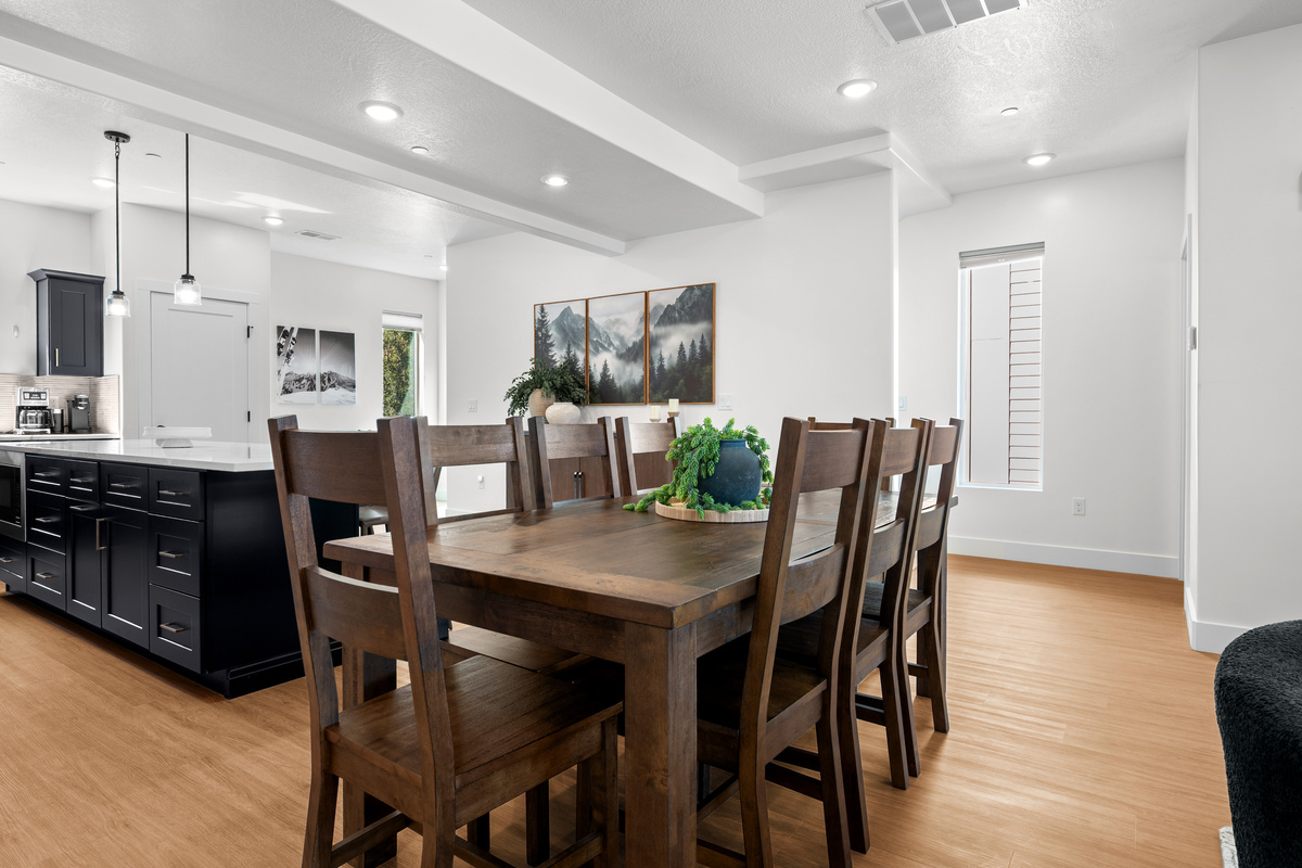 Enjoy meals together at the dining table just steps from the kitchen, making group dinners relaxed and convenient.