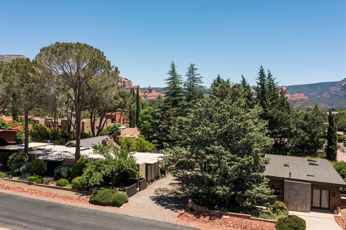 Nestled among mature pines in a prime Sedona setting, with stunning red rock views just beyond the treetops.