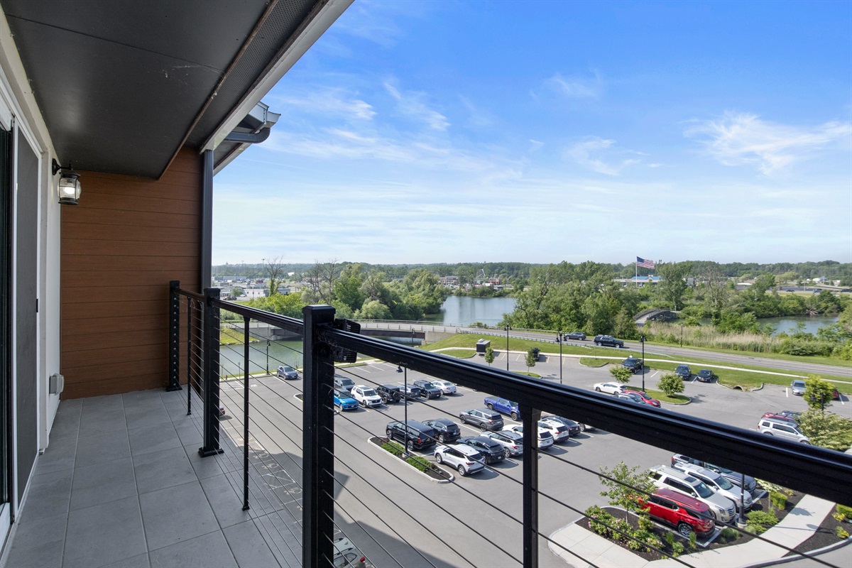 Enjoy your morning coffee with sweeping views of the water and vibrant surroundings from your private balcony