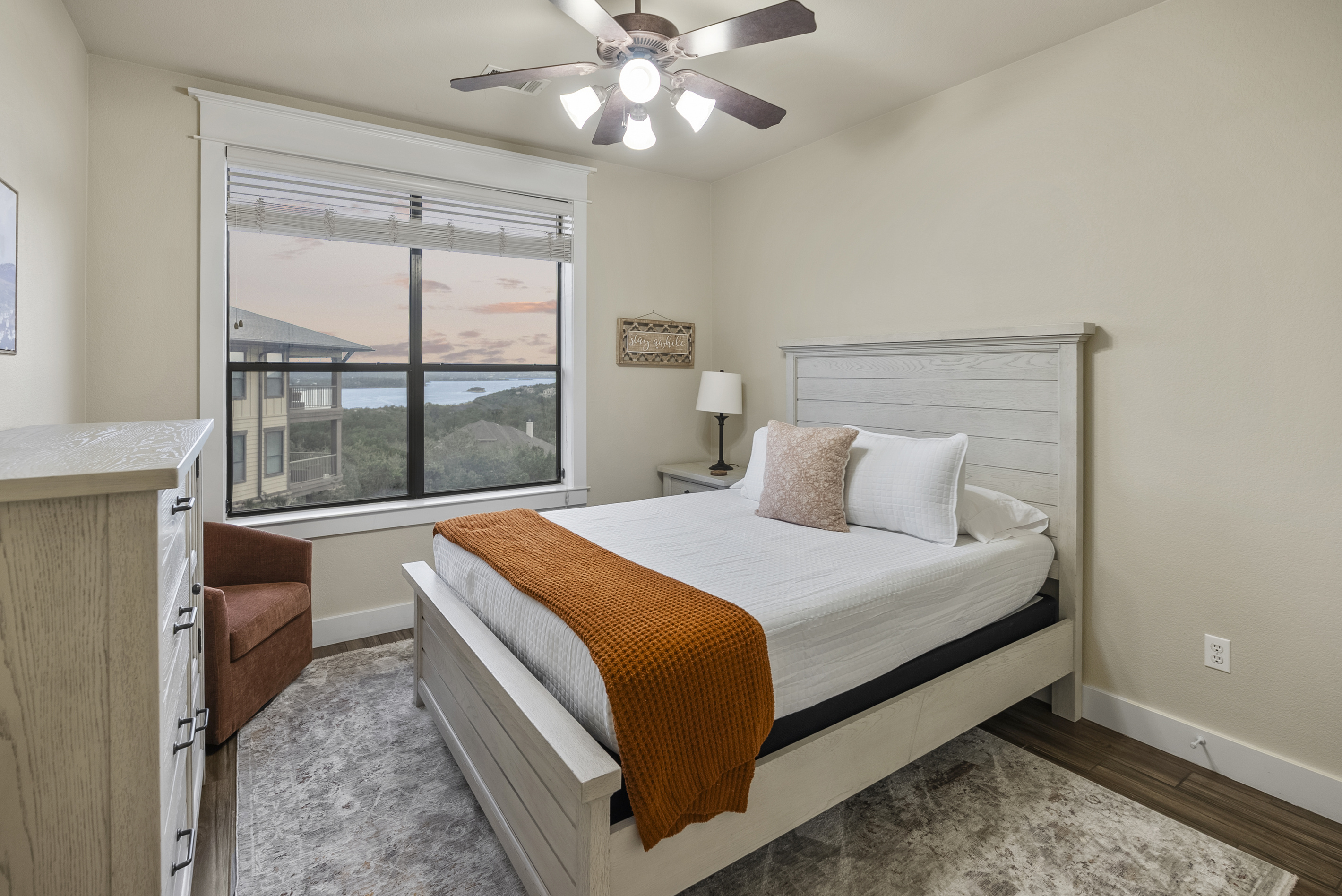 Comfortable guest bedroom with a queen bed, ideal for couples or extra adult guests.