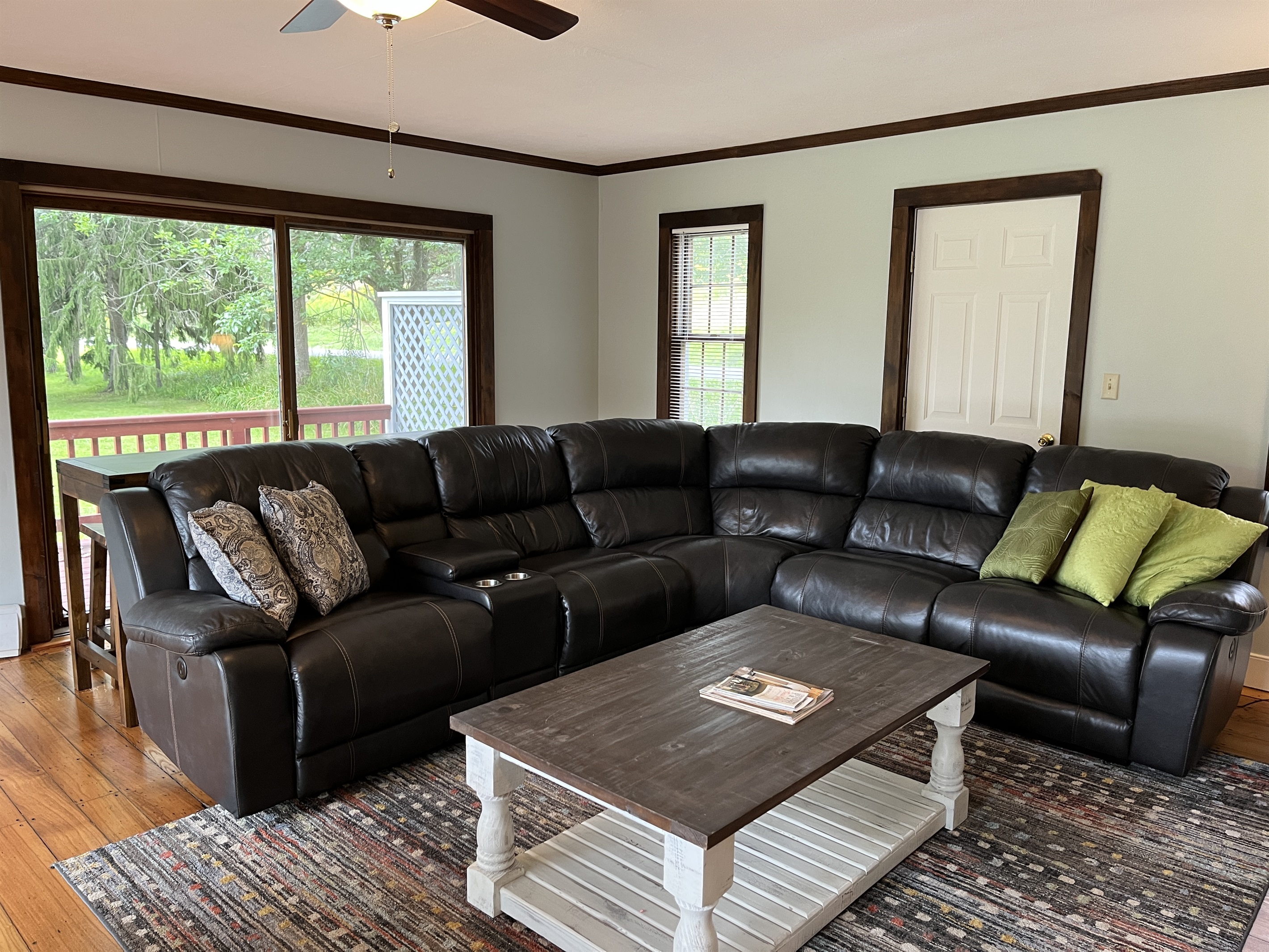 Cloverleaf Farm living room with stadium seating in the electric reclining couch.