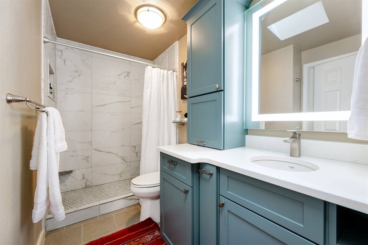 Upstairs bathroom with walk in shower.  Adjoining to both upstairs bedrooms.