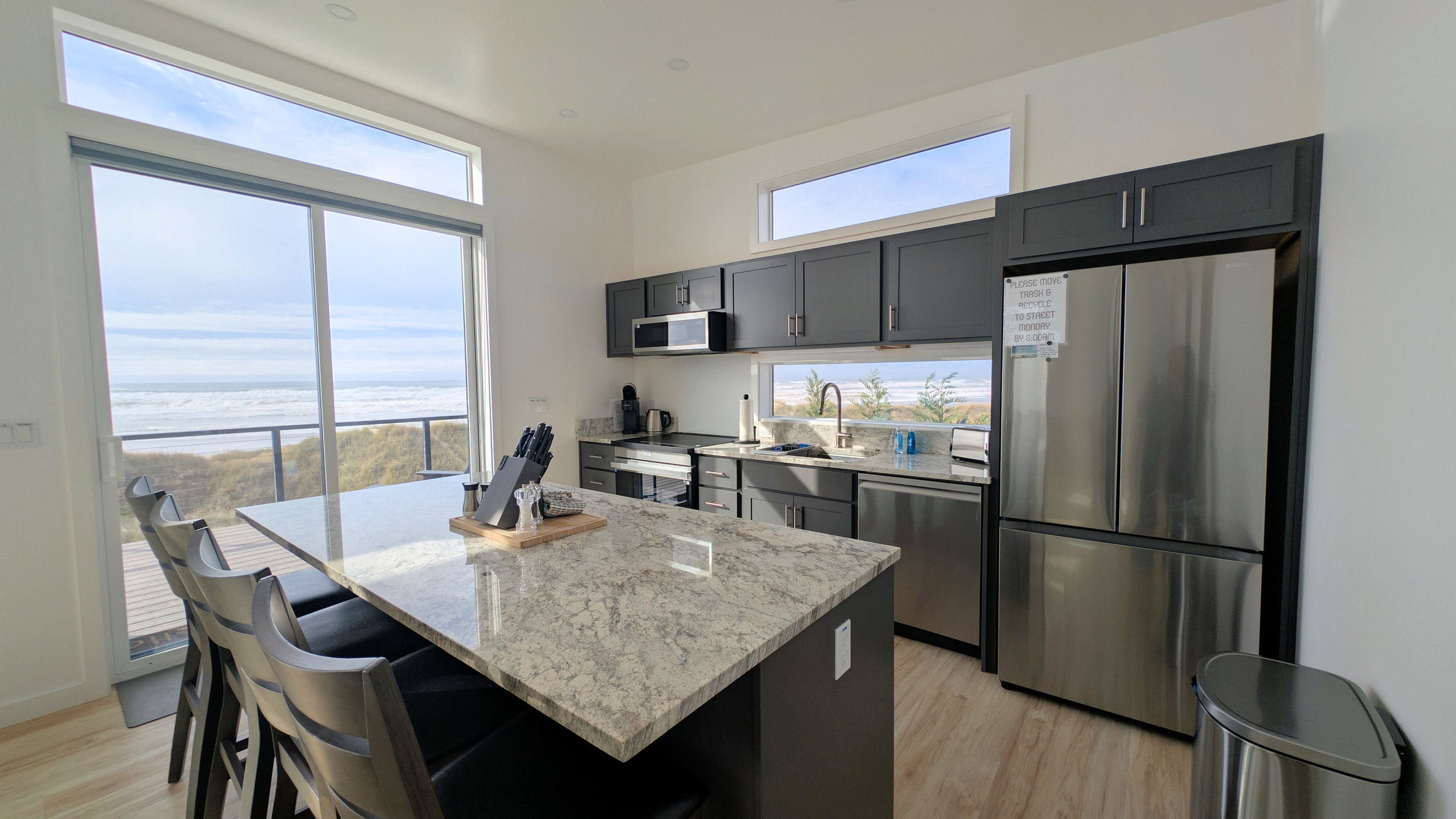 center island with seating for 3 and a view
