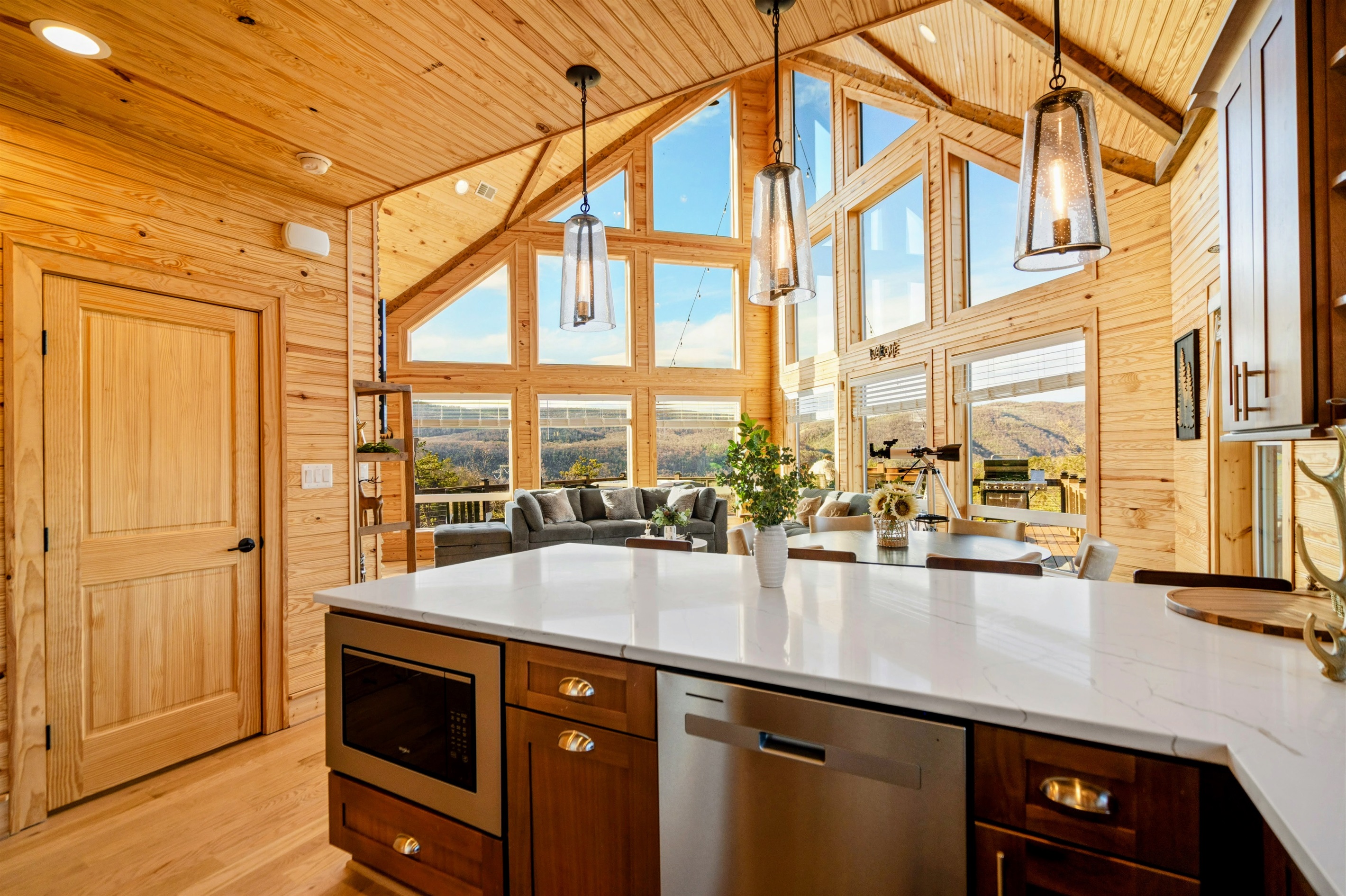 Gather Here – Spacious countertops, warm wood finishes, and stunning views invite connection over every meal.