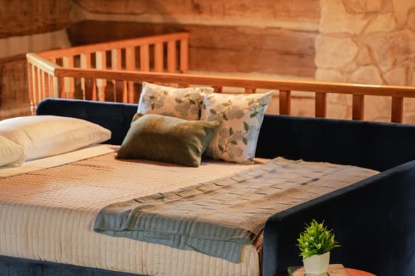 Queen bed with a plush pillow-top memory foam mattress, designed for comfort and relaxation.