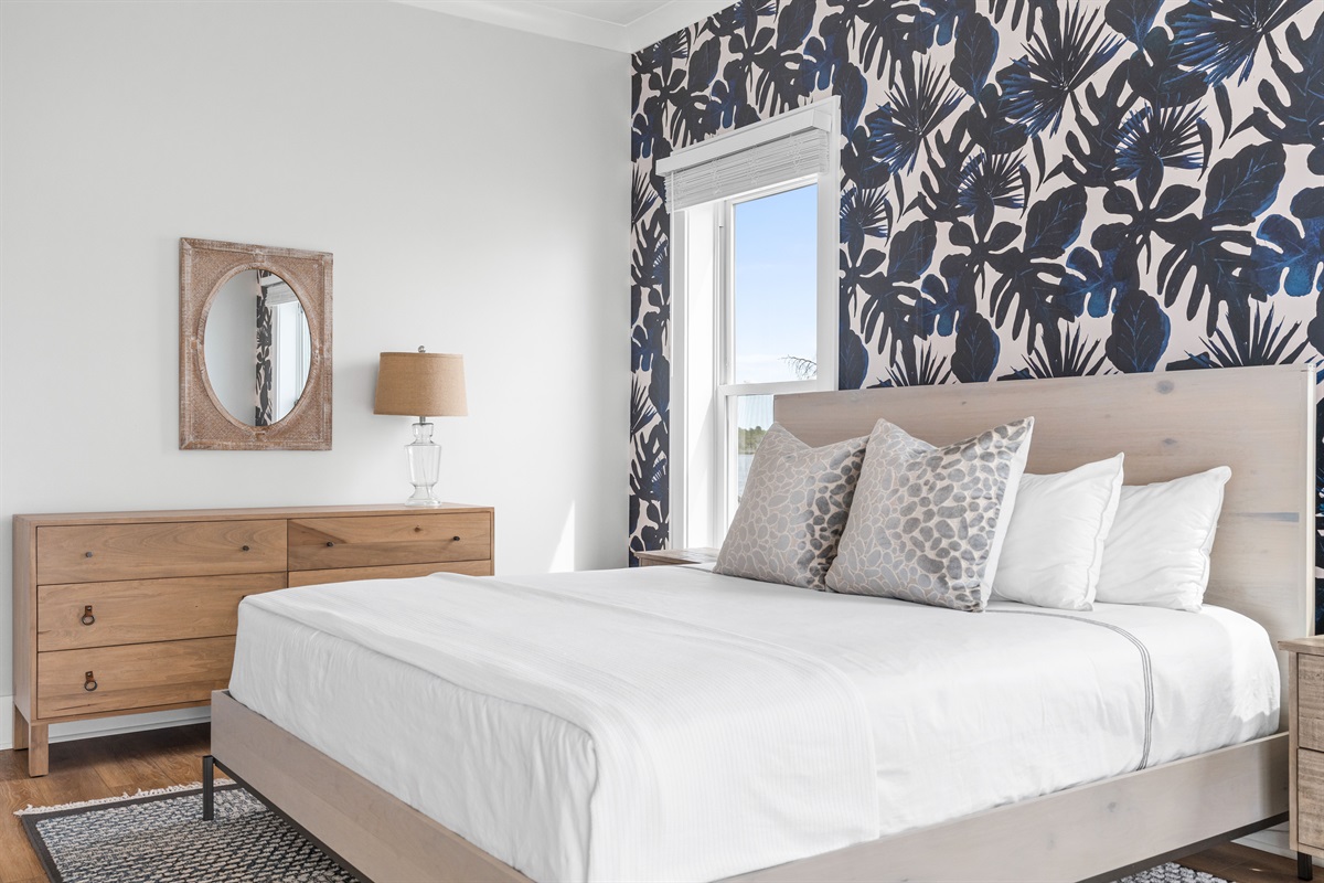 Relax in this private 1st-floor master suite offering a king bed, ensuite bathroom, and stunning water views