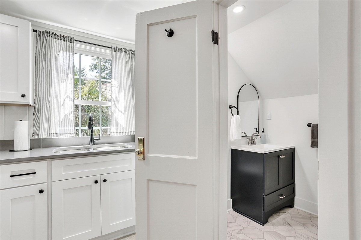 Conveniently located just off the kitchen, the bathroom is easy to access without interrupting your flow.