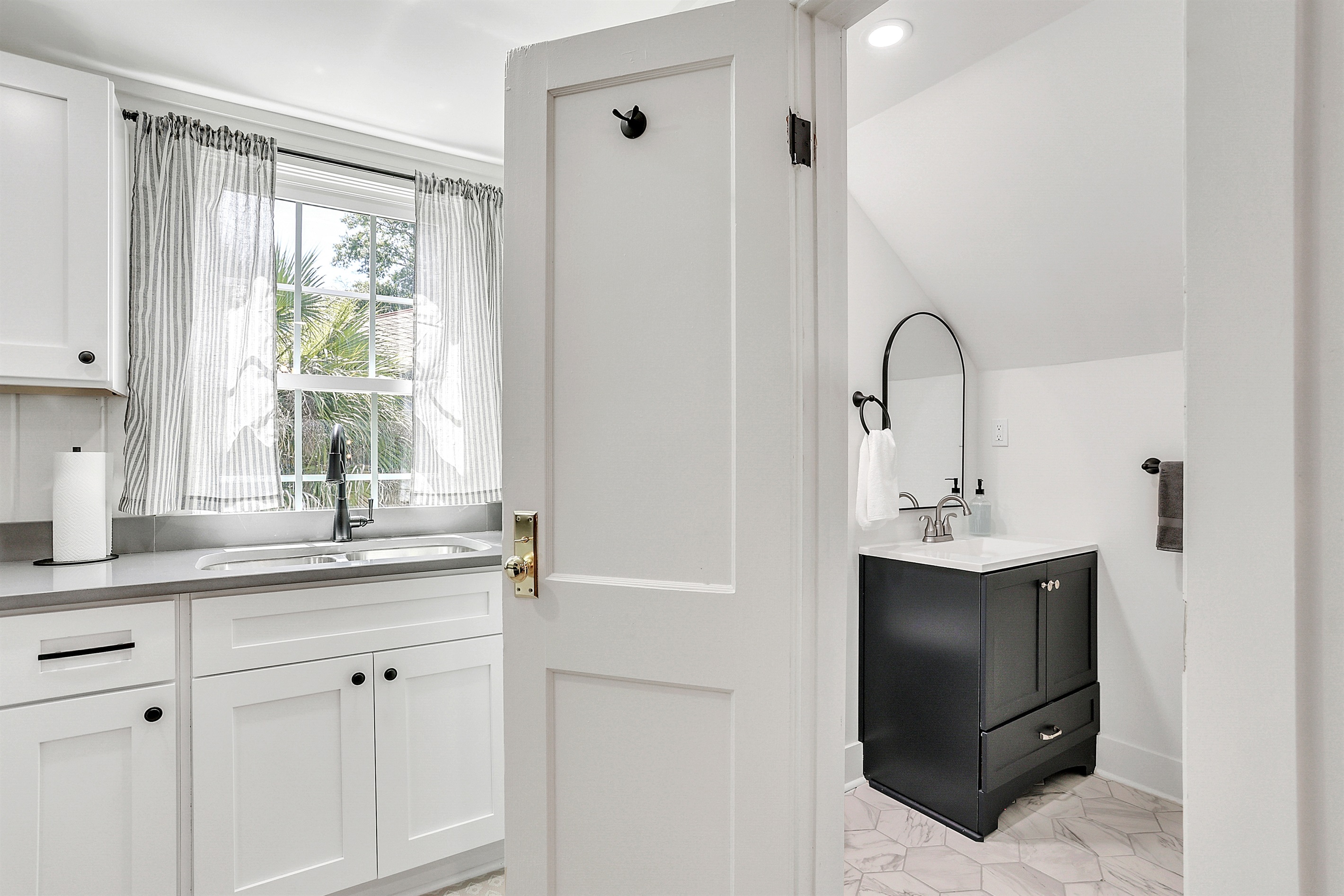 Conveniently located just off the kitchen, the bathroom is easy to access without interrupting your flow.