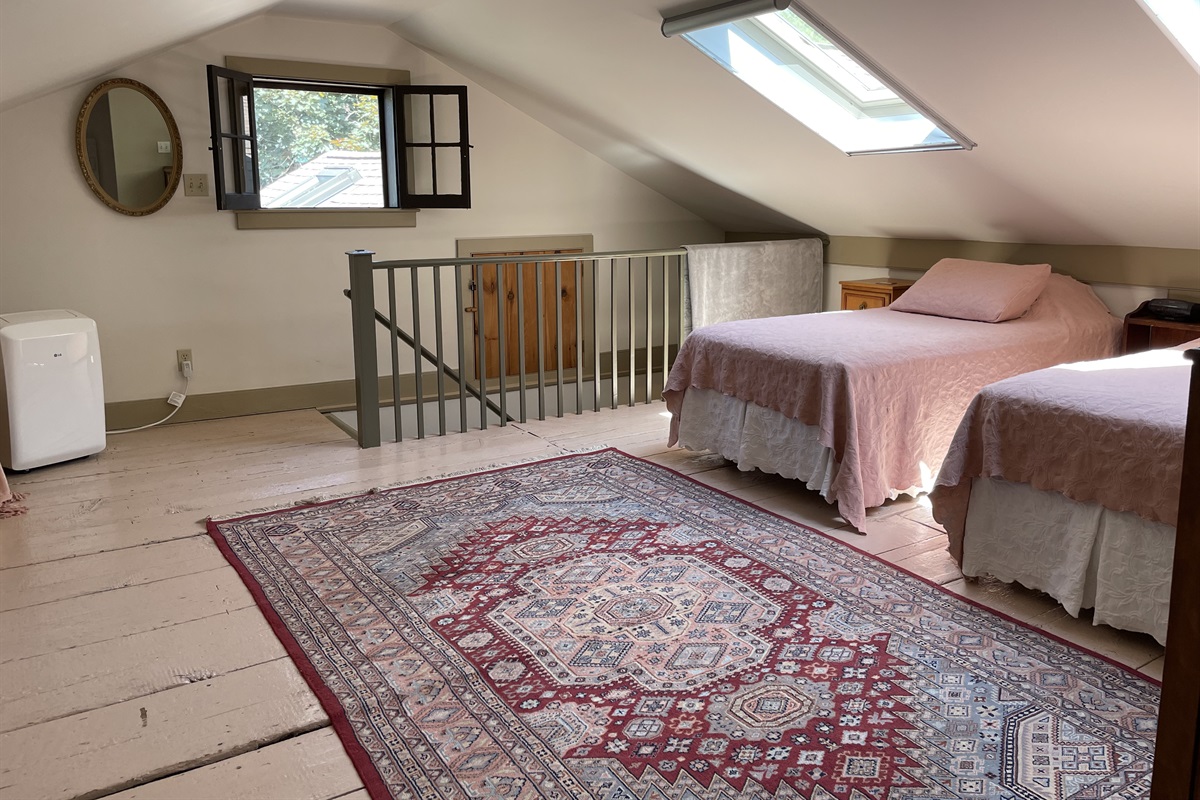 2 Twin beds and a queen bed in sleeping loft.