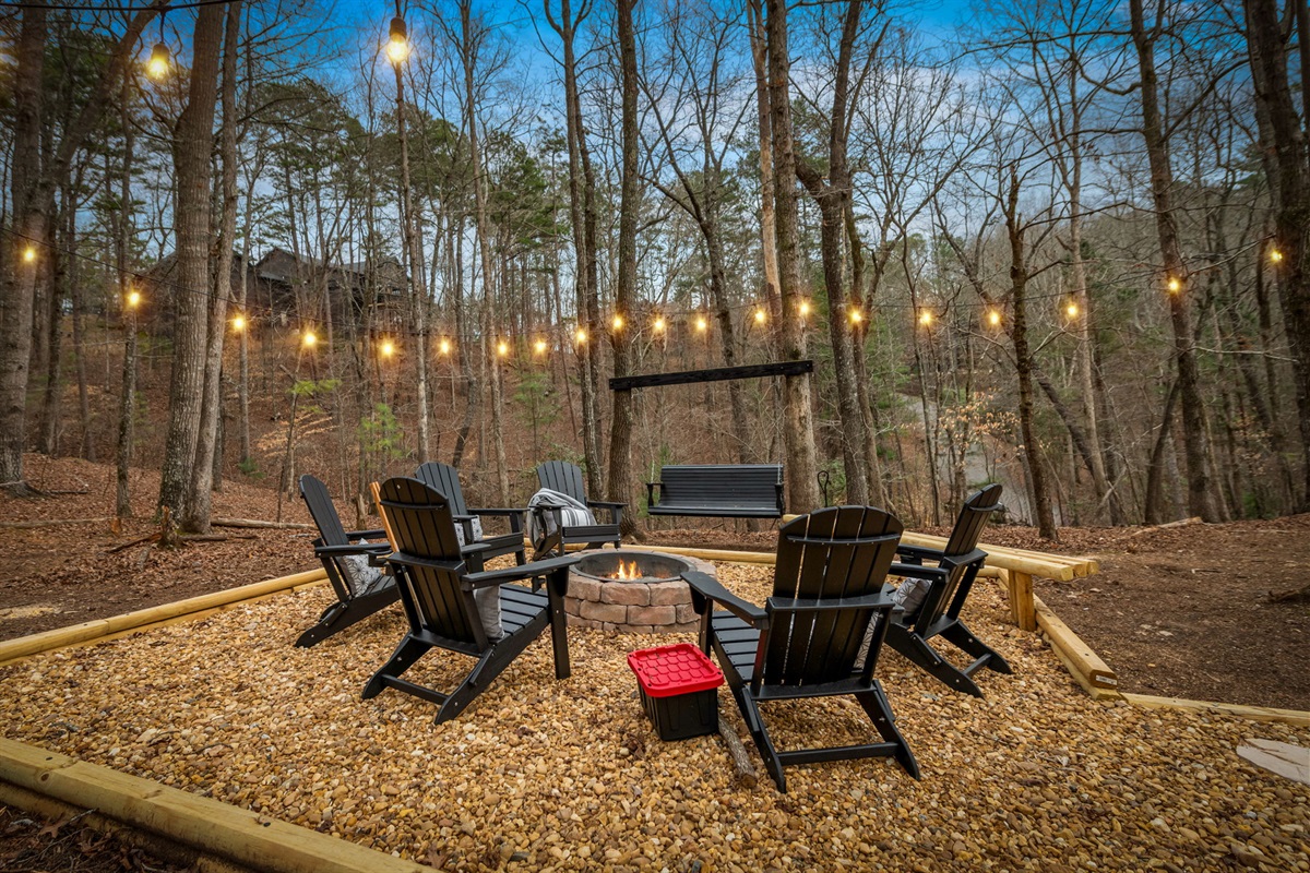 Comfortable chairs are arranged around the fire, creating a cozy setting for relaxation and connection.