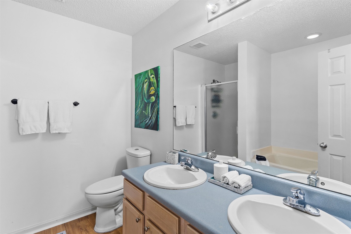 Primary bathroom attached with stand up shower and oversized soaking tub.
