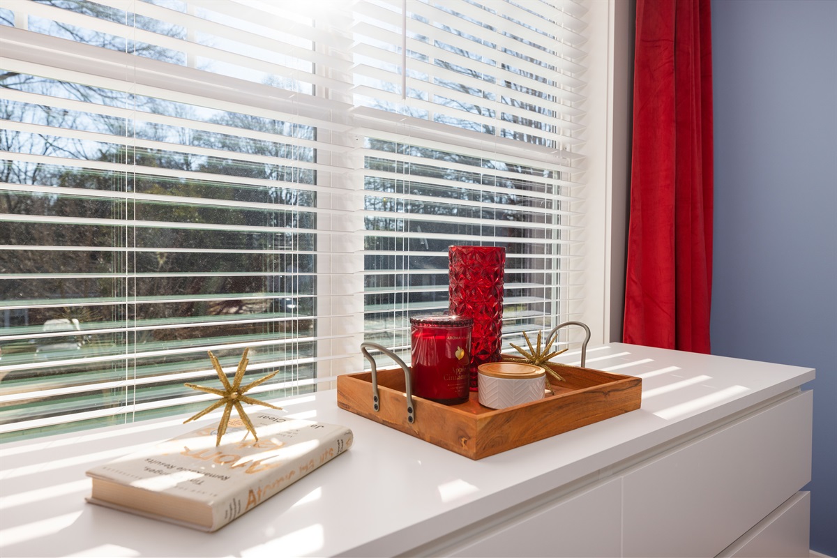 Enjoy the blackout curtains, extra clothing storage, and thoughtful details in the queen-sized bedroom. 