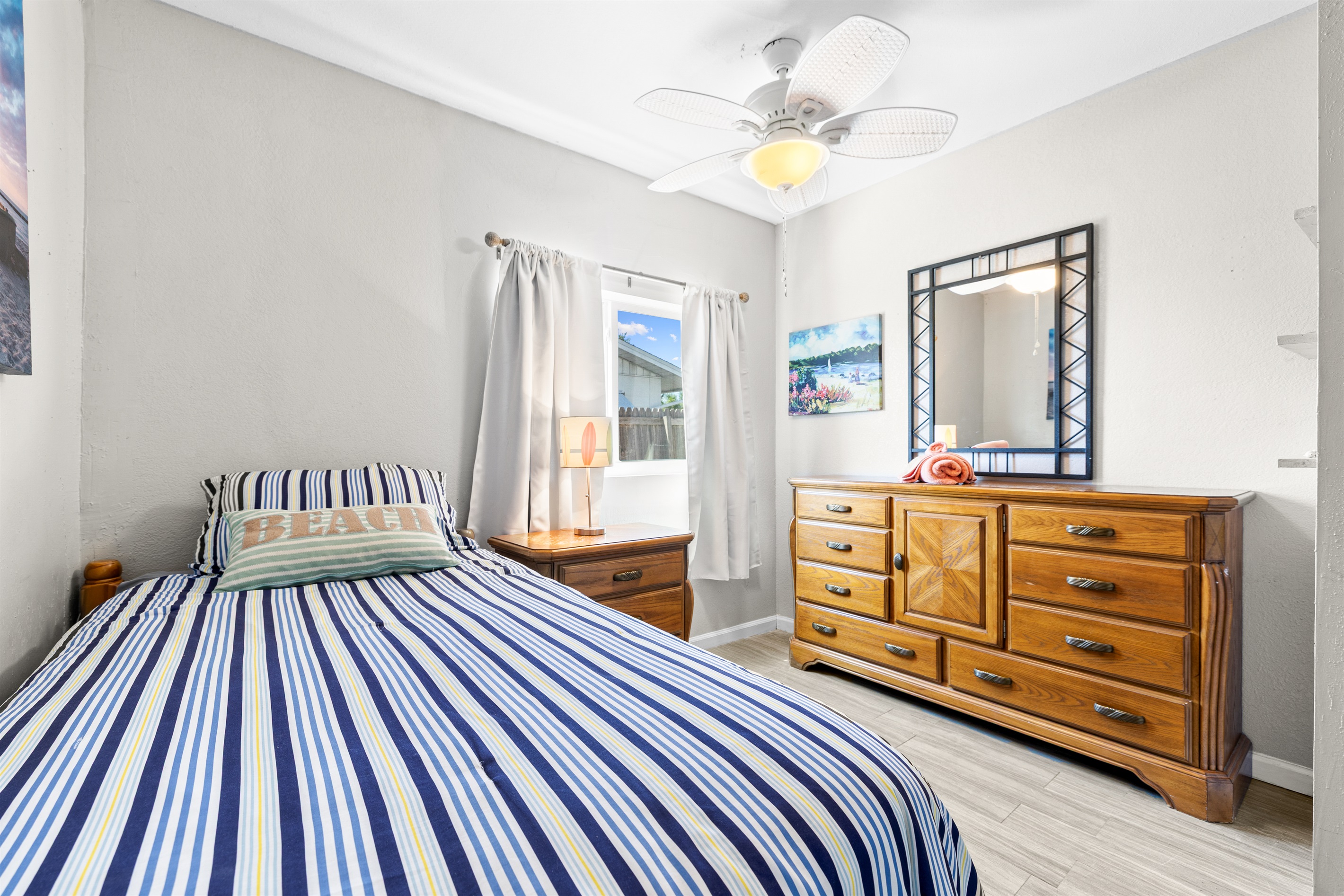 Dolphin Pod Twin room with Linens.  Nightstand, dresser and closet!