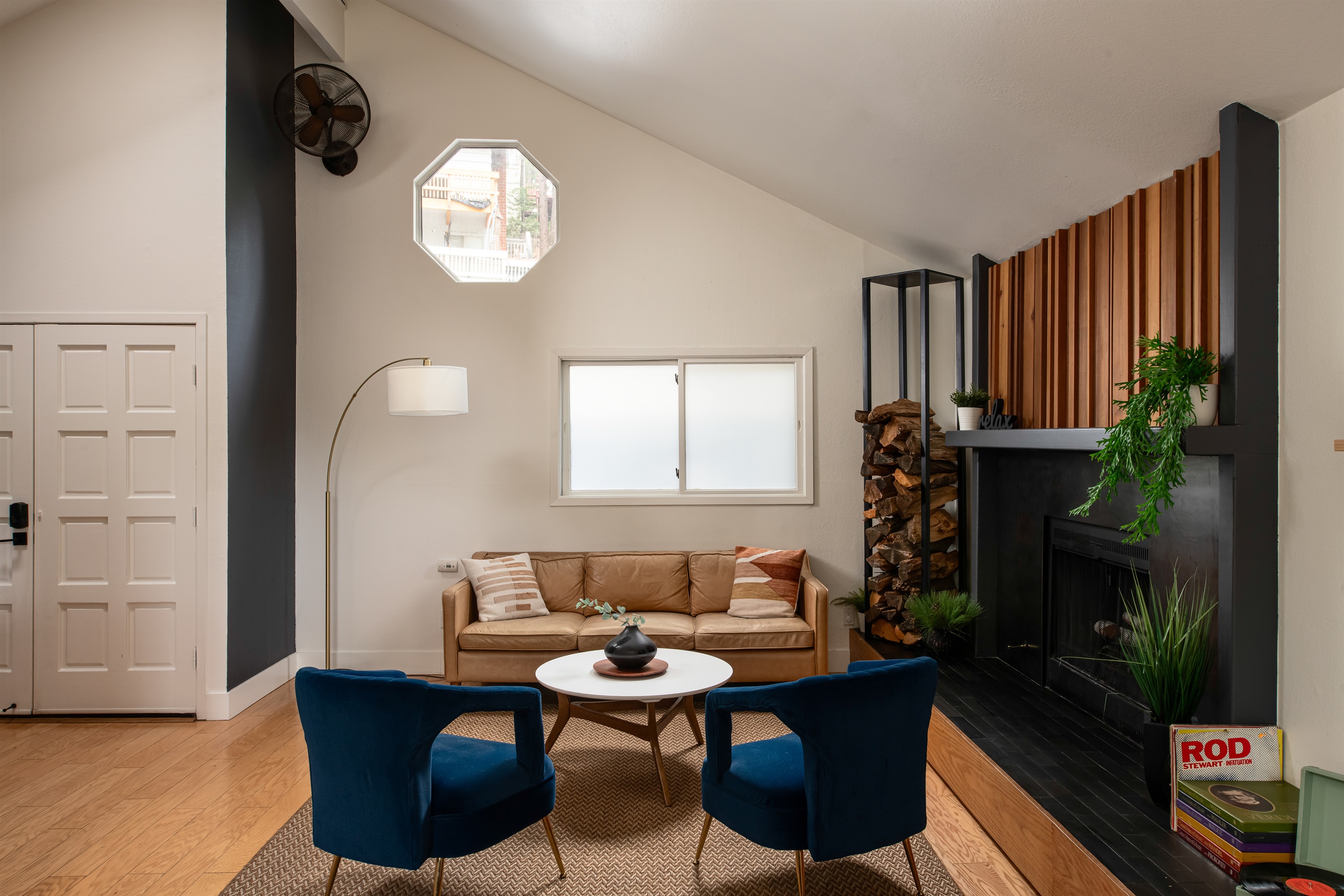 Comfortable living room with fireplace and seating—perfect for relaxing, gathering, and unwinding during your Lake Arrowhead cabin getaway.