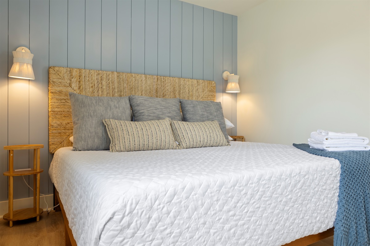 Charging stations on both sides of the king bed
