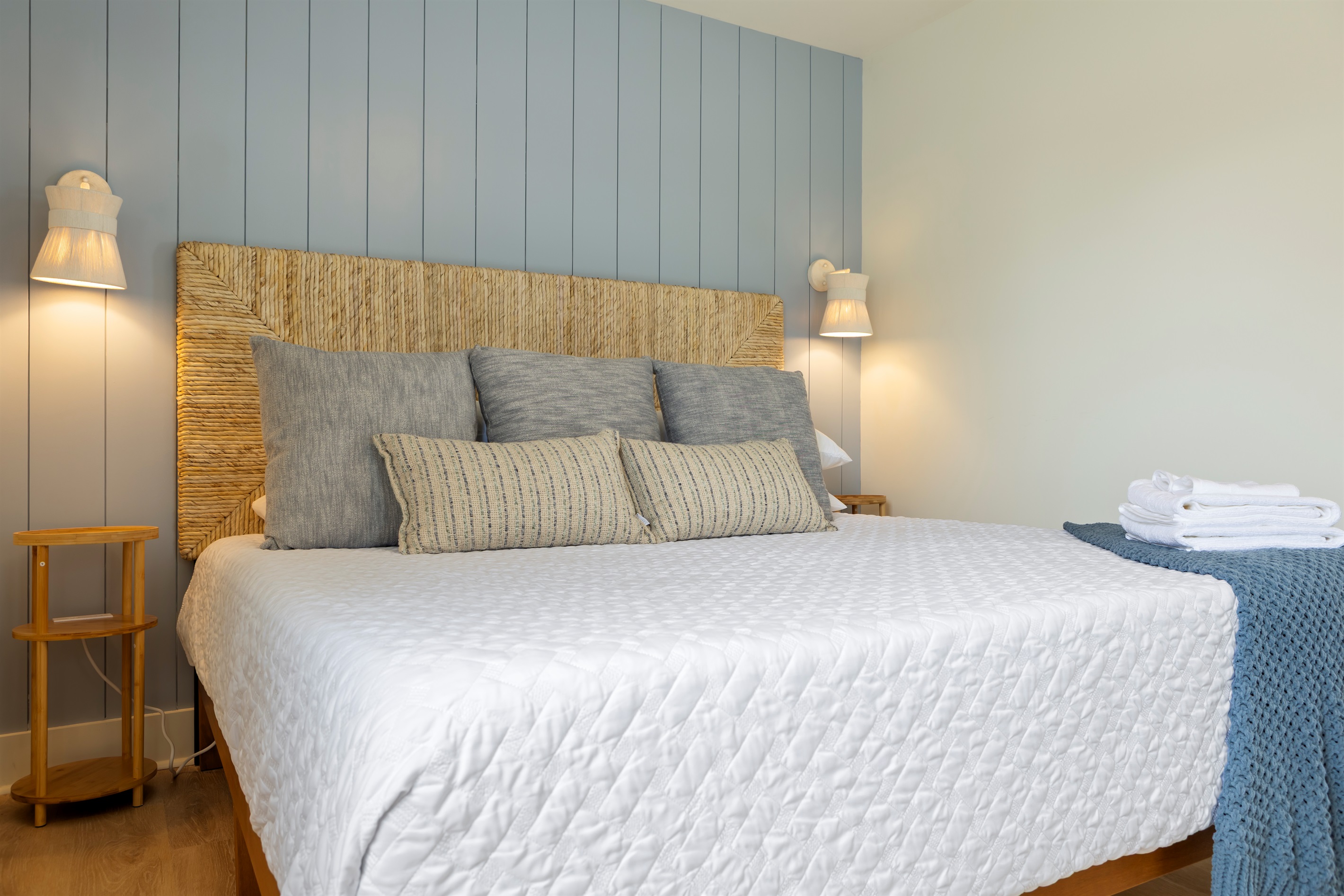 Charging stations on both sides of the king bed