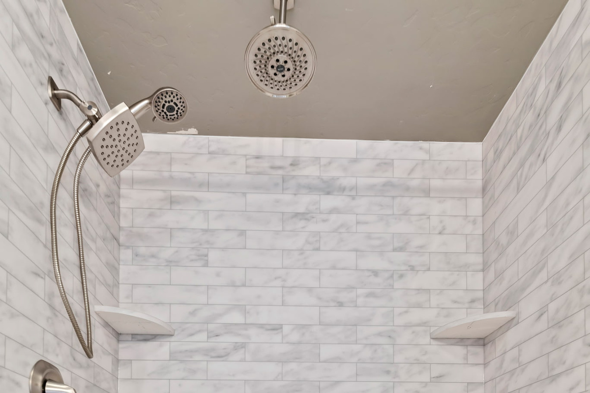 Updated bathroom featuring a large garden tub, creating the perfect space to relax and unwind. 