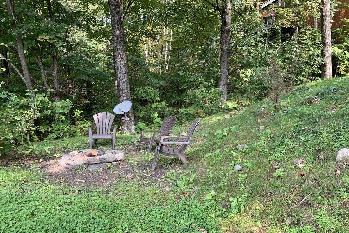 Seating on the level area around fire pit on lower lawn