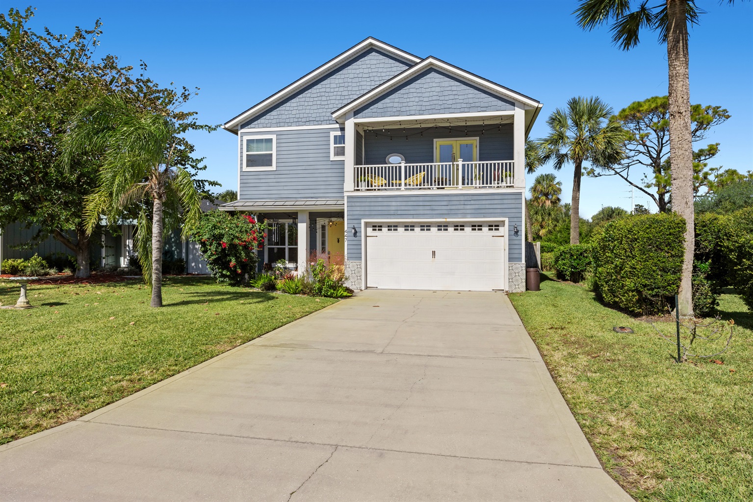 Charming Coastal Home with Balcony
A beautifully maintained two‑story coastal home featuring a spacious balcony, crisp blue siding, and lush tropical landscaping. The wide driveway and inviting exterior set the tone for a relaxing beachside stay.
