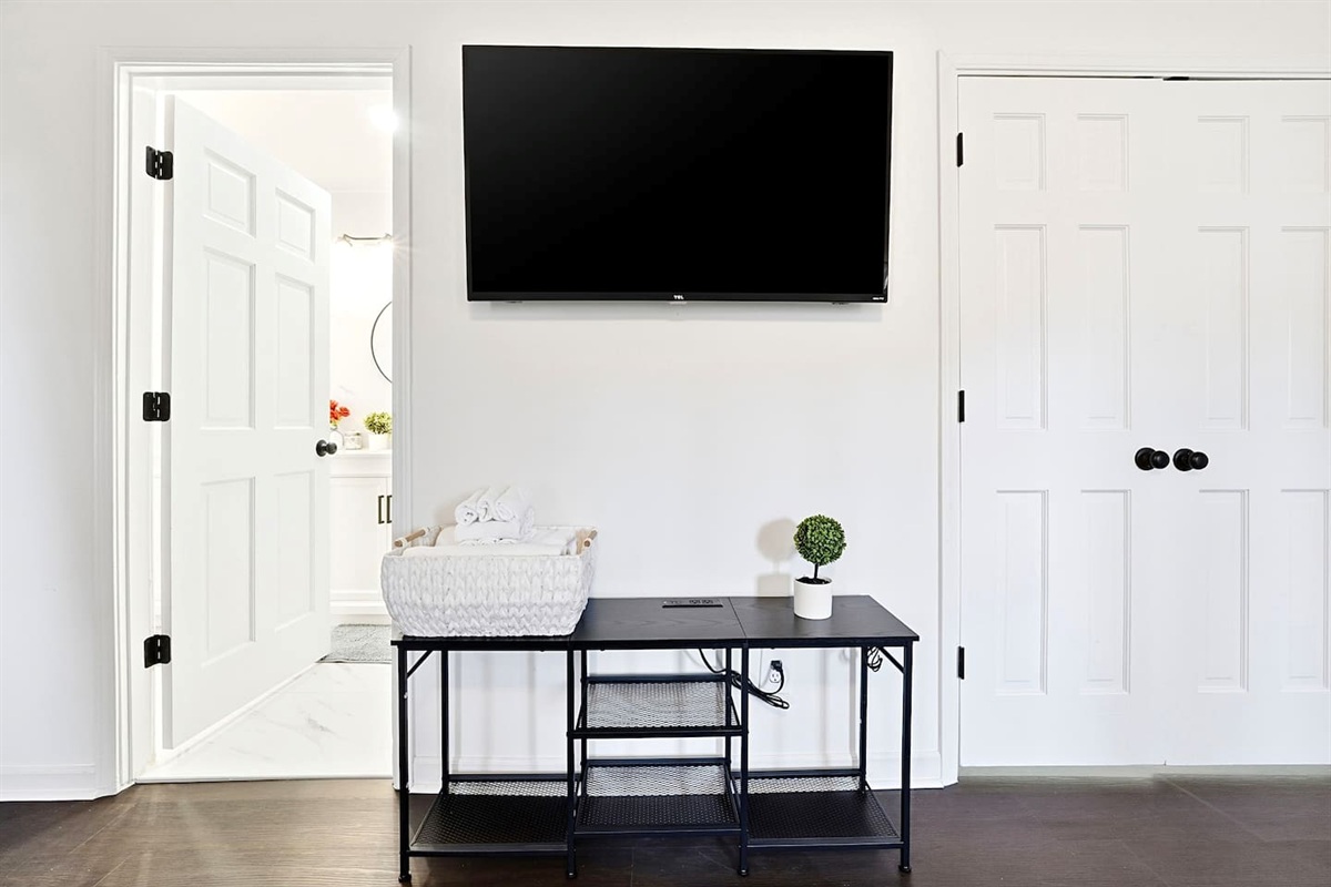 Spacious first-floor master bedroom located to the far right as you enter through the front door. This earthy, calming retreat features a king bed and smart TV. This room includes 2 full-body towels, 2 washcloths, and 2 hand towels for your stay.