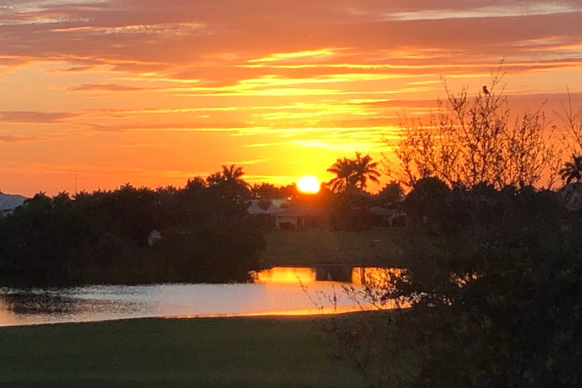 Sunset in the winter over the golf course. (yes that is a pond).