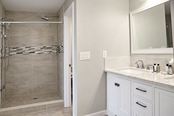 Spa-like Bathroom: Indulge in a refreshing shower in sleek, modern surroundings—your private retreat awaits!