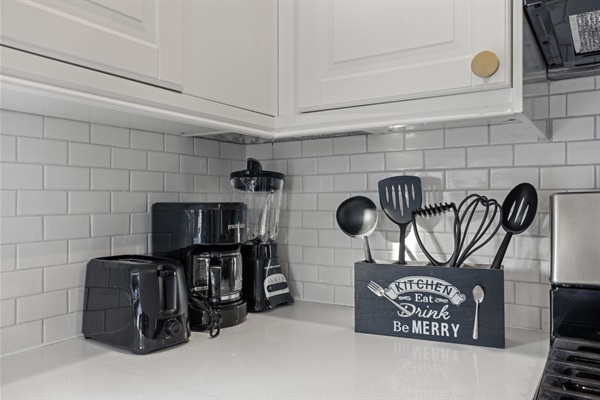 Cook Up a Storm! – Discover your inner chef in our well-stocked kitchen, featuring utensils and kitchenware.