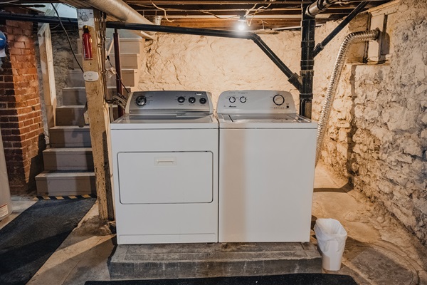 Washer/dryer in basement/shelf and laundry basket