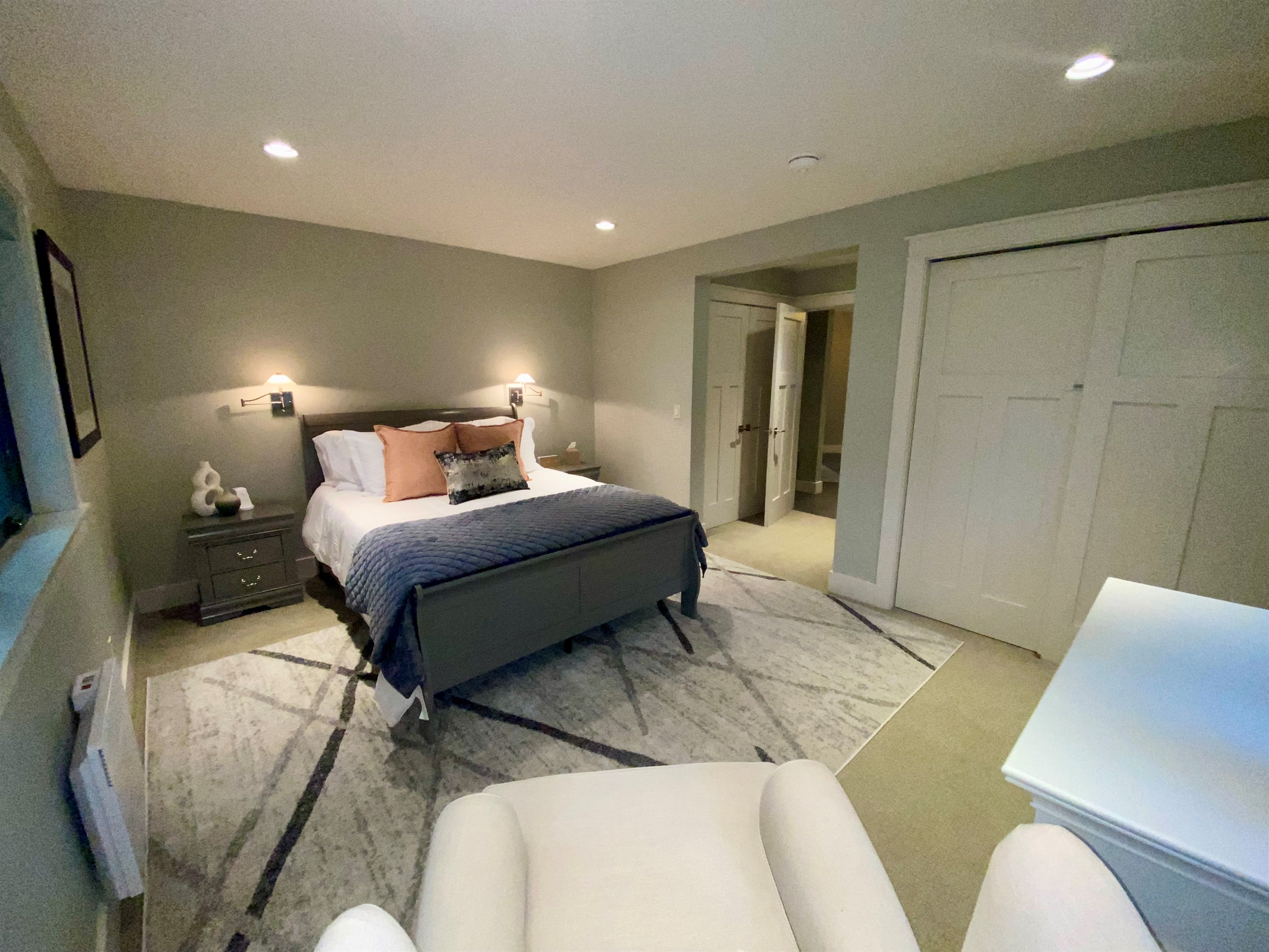 The second Primary bedroom features a comfortable Queen bed perfect for a relaxing morning to stay and snuggle under the covers.