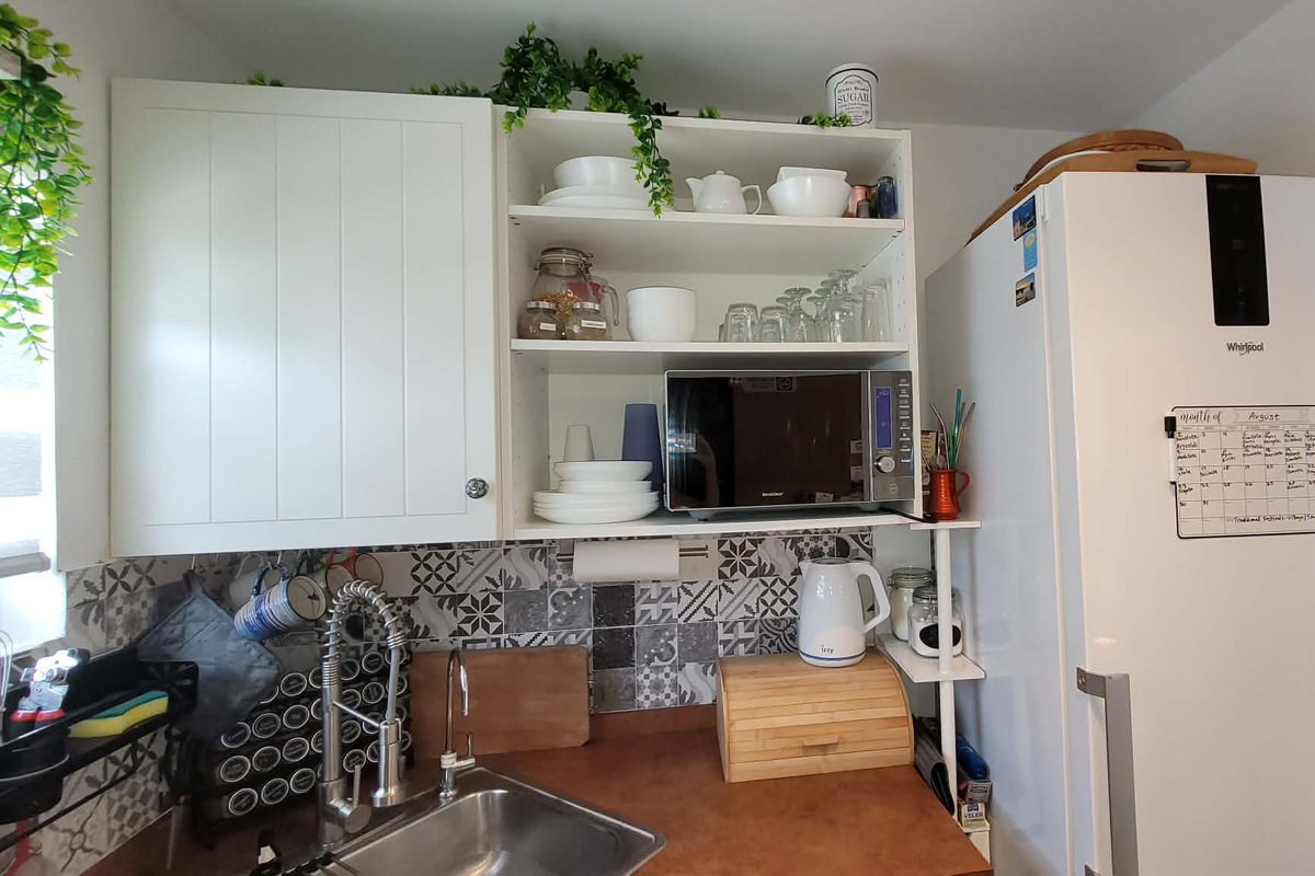 Fully stocked kitchen: Full size refrigerator, Convection oven, & Dishwasher