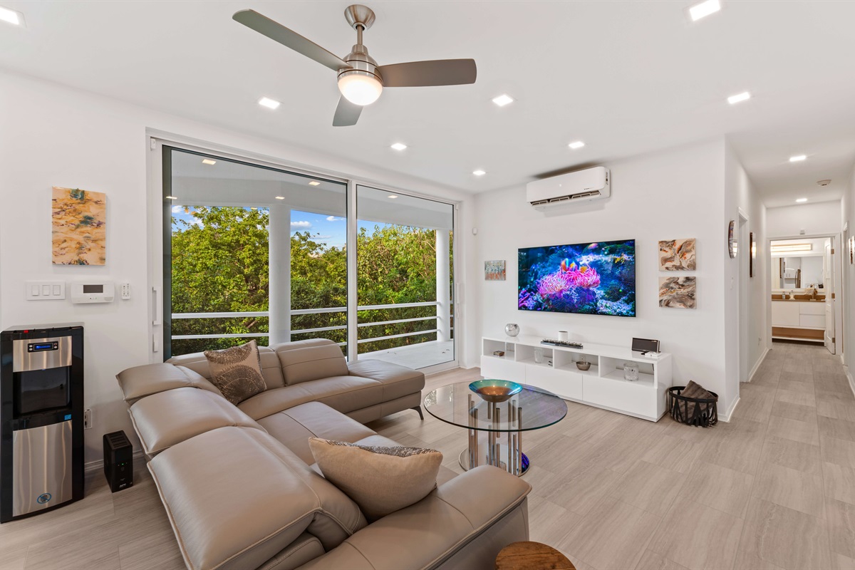 A smart TV with lots of seating is the perfect place for guests looking to relax