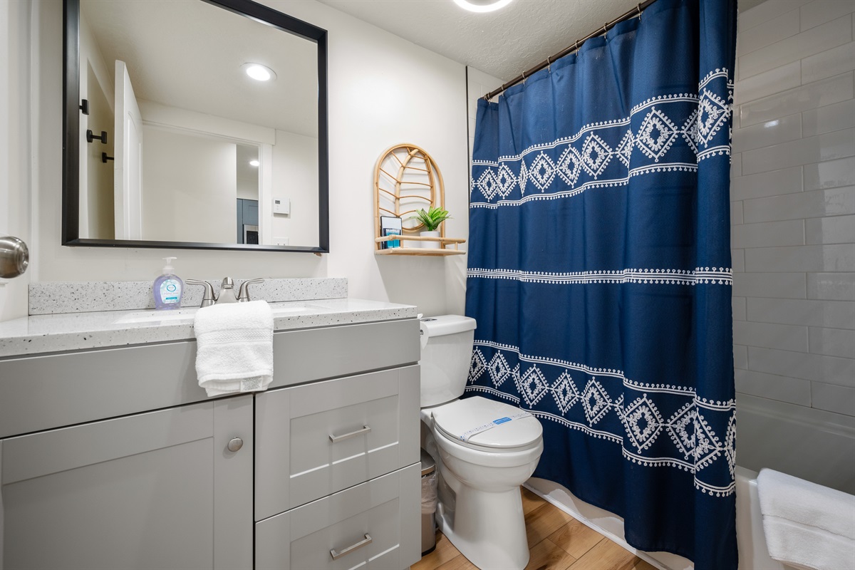 Ample storage space is available for your belongings, along with a combined shower and bathtub in the bathroom.