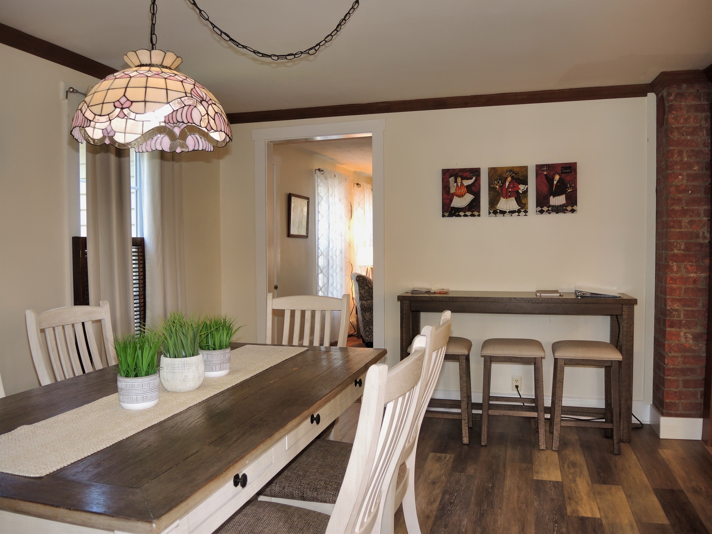 Additional seating at the high top bar table in the dining room.