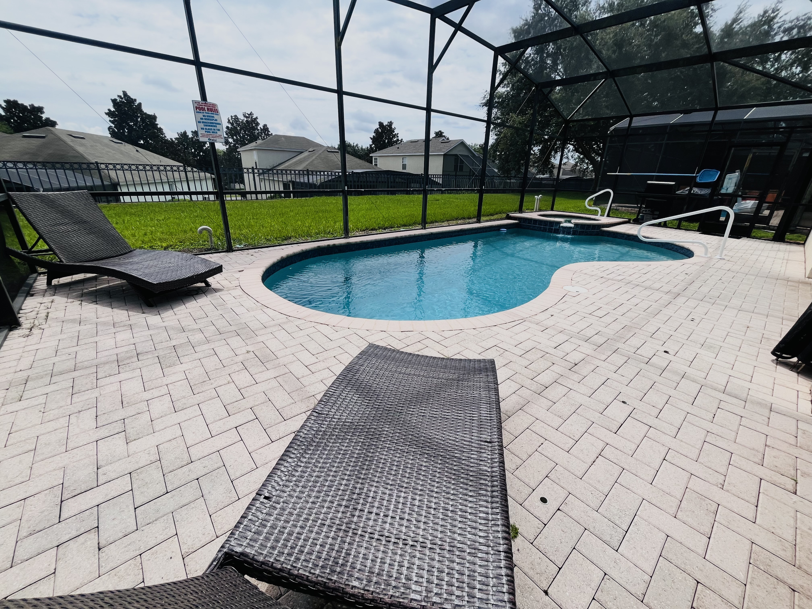 Pool and hot tub in a private screened patio