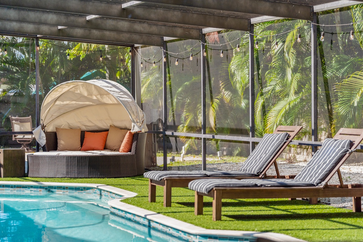 Covered and screened hot tub, ping pong, heated pool and patio.