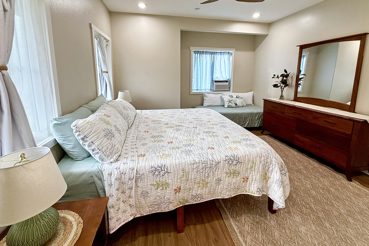 King + Twin Bed | Representative Interior. Finishes, decor, and furniture, vary by unit.