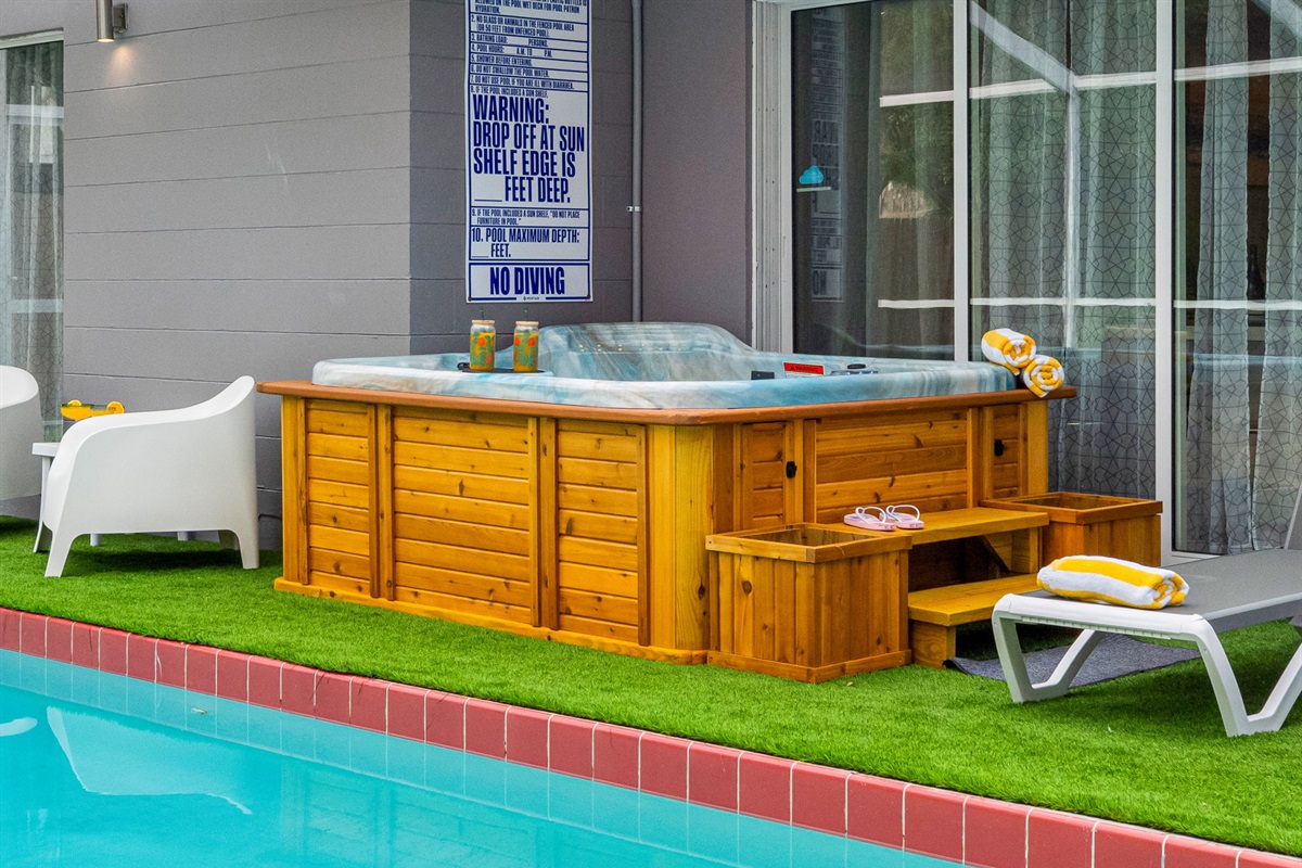 Wrapped in warm wood tones and topped with plush rolled towels, this bubbling spa is calling your name after a long day in the sun.