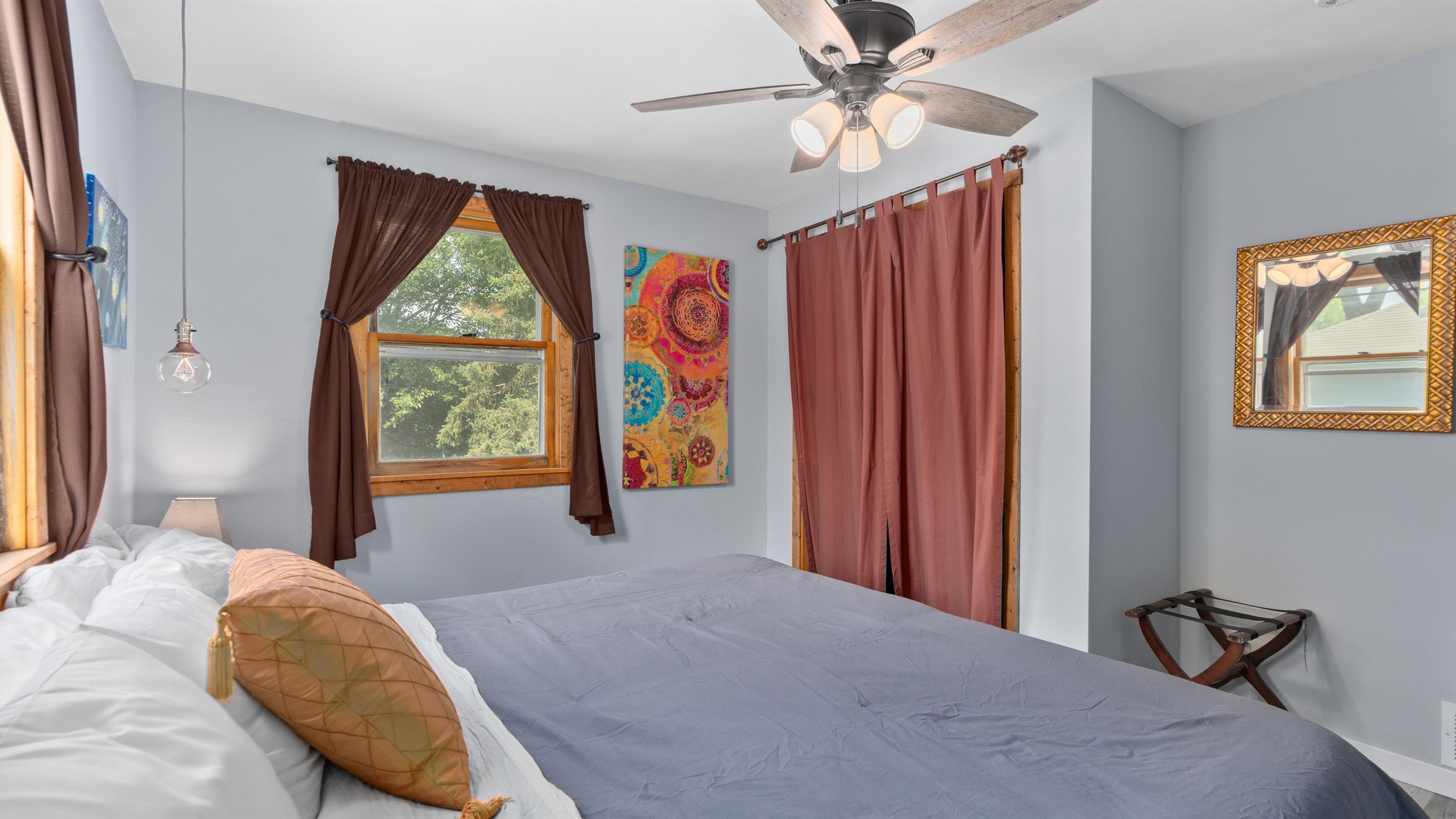The upstairs king bedroom overlooks the backyard.