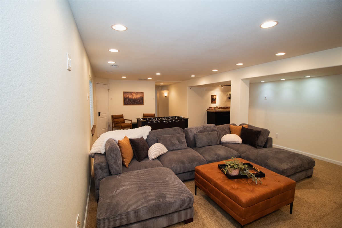 Theater lighting, comfortable seating, huge TV, and foosball!