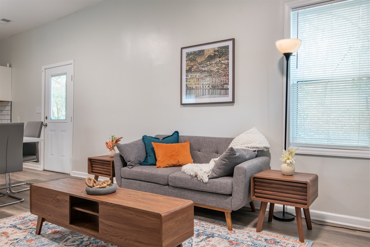 Relax in style with this comfy, colorful living space and  make yourself at home.