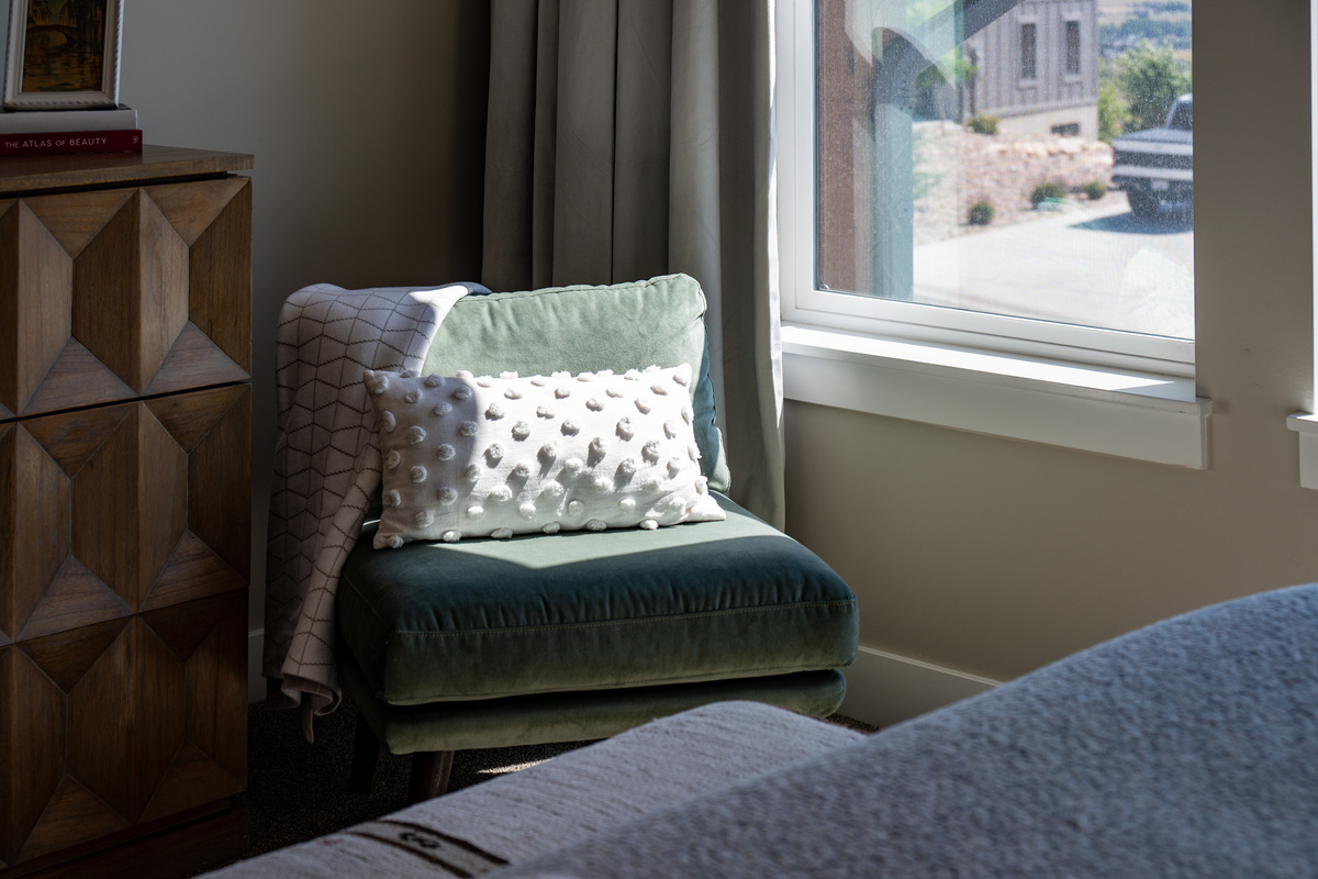 Curl up with a good book or morning coffee in the cozy reading corner while taking in the peaceful mountain surroundings.