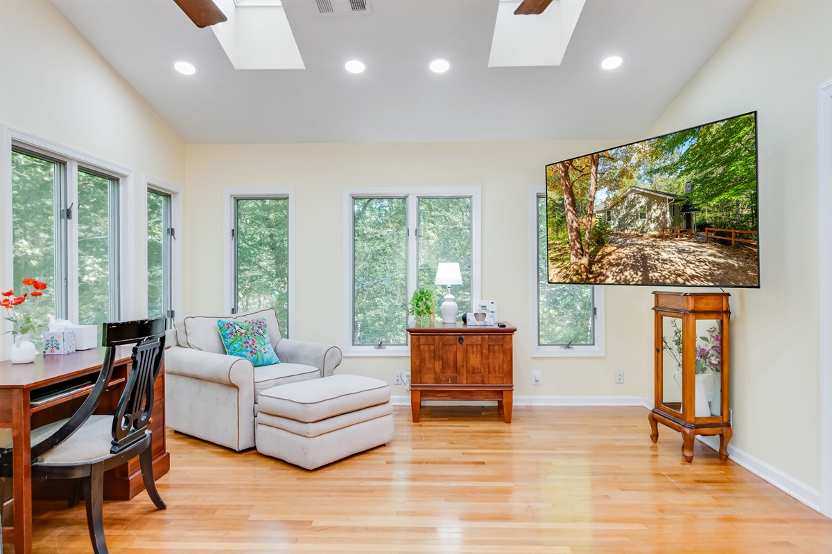 Living Room: Bright, airy space with comfy seating and stunning nature views awaits. Living Room is equipped with Smart TV.