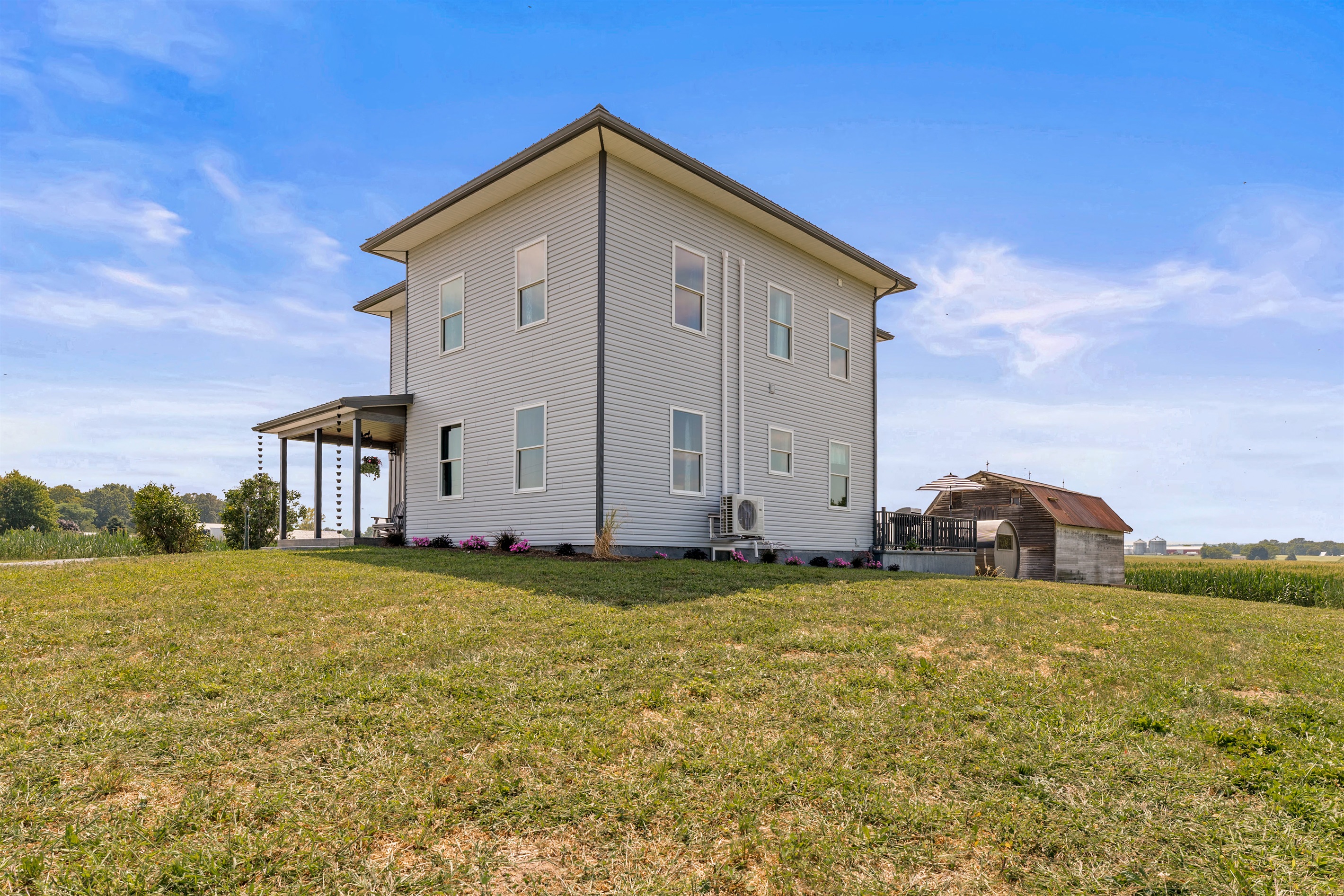 Modern farmhouse charm meets country serenity—this spacious two-story home offers open skies, peaceful views, and plenty of room to relax.