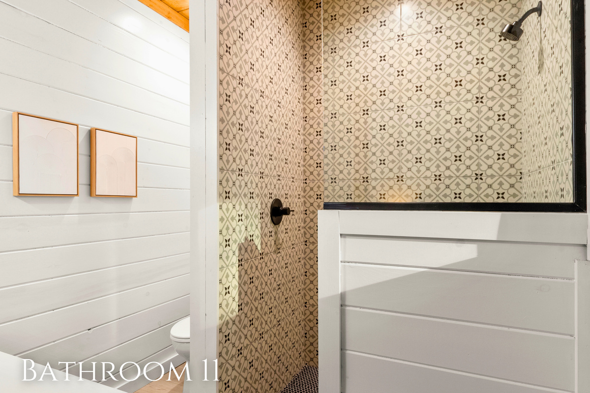 Discover a touch of elegance in the Additional Bathroom&mdash;your charming enclave with patterned tiles for a refreshing morning shower.