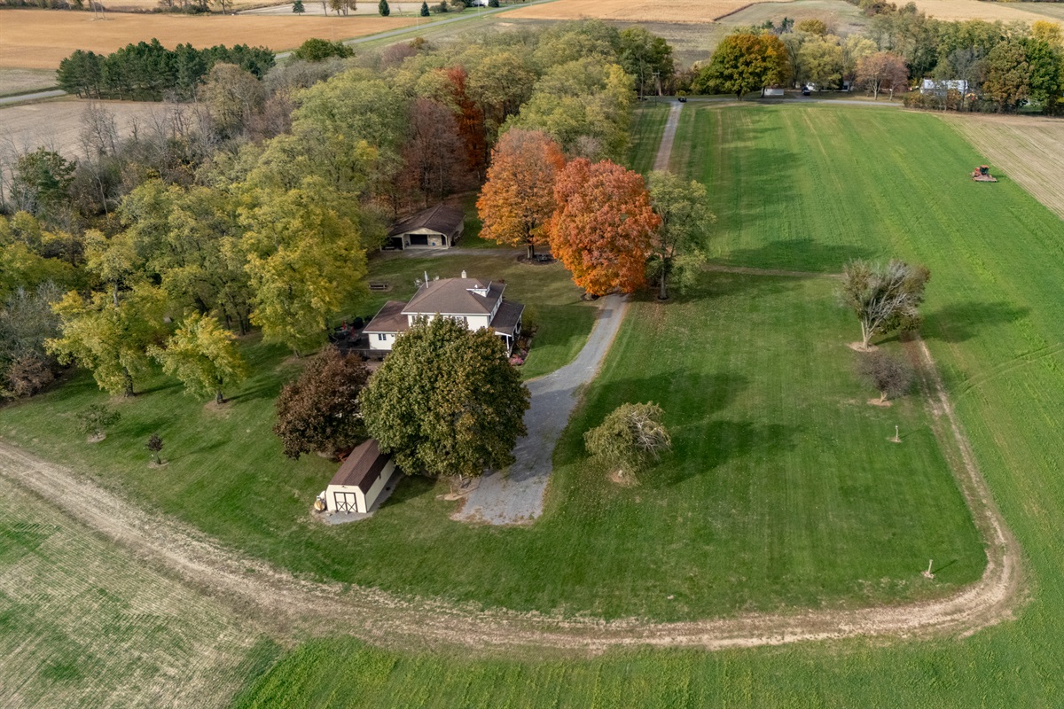 A charming farmhouse nestled among brilliant fall colors