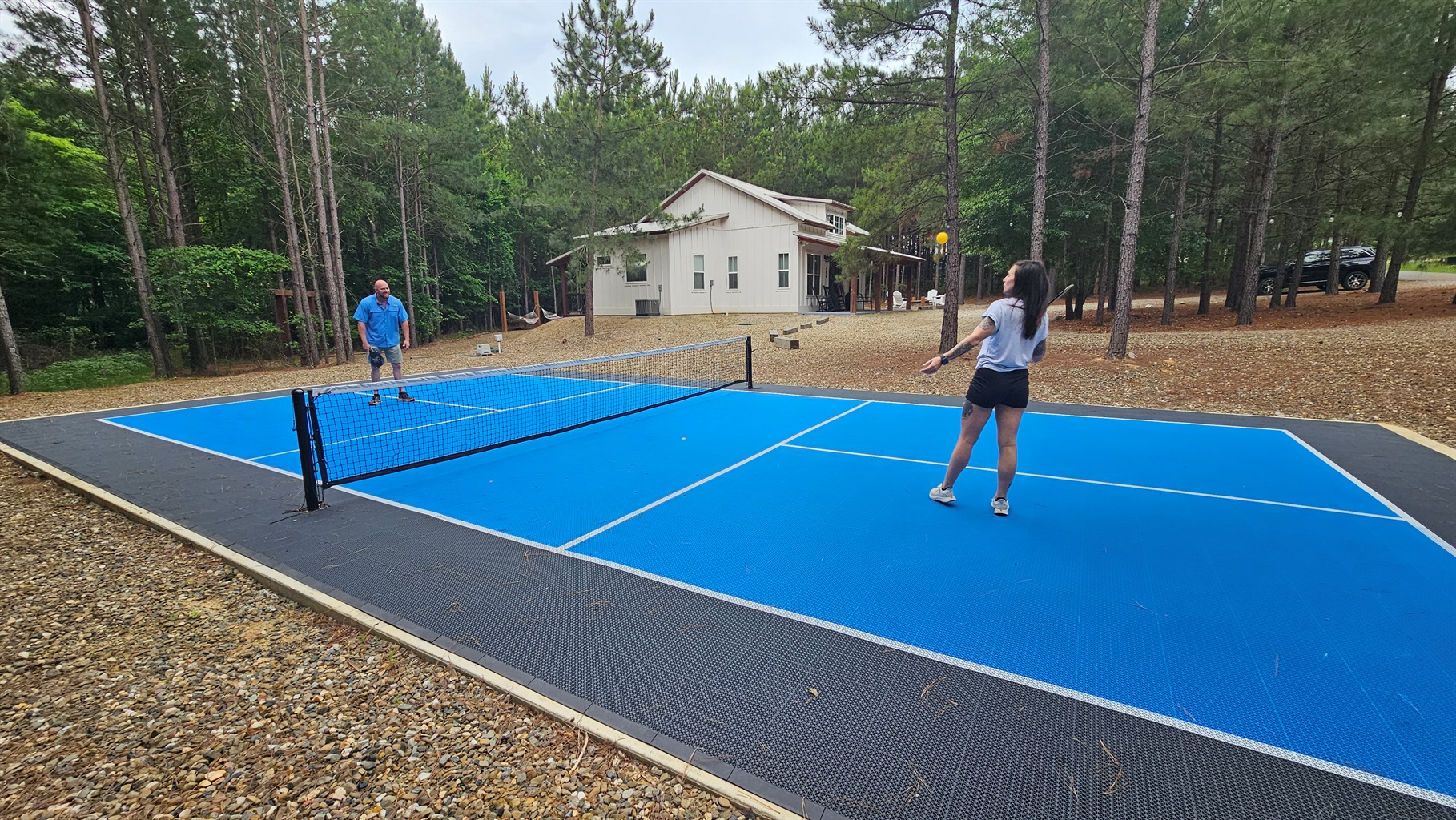 Private pickleball court—fun, playful moments together in a secluded setting